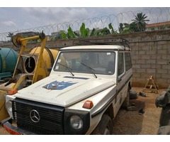 2 white Mercedes jeeps